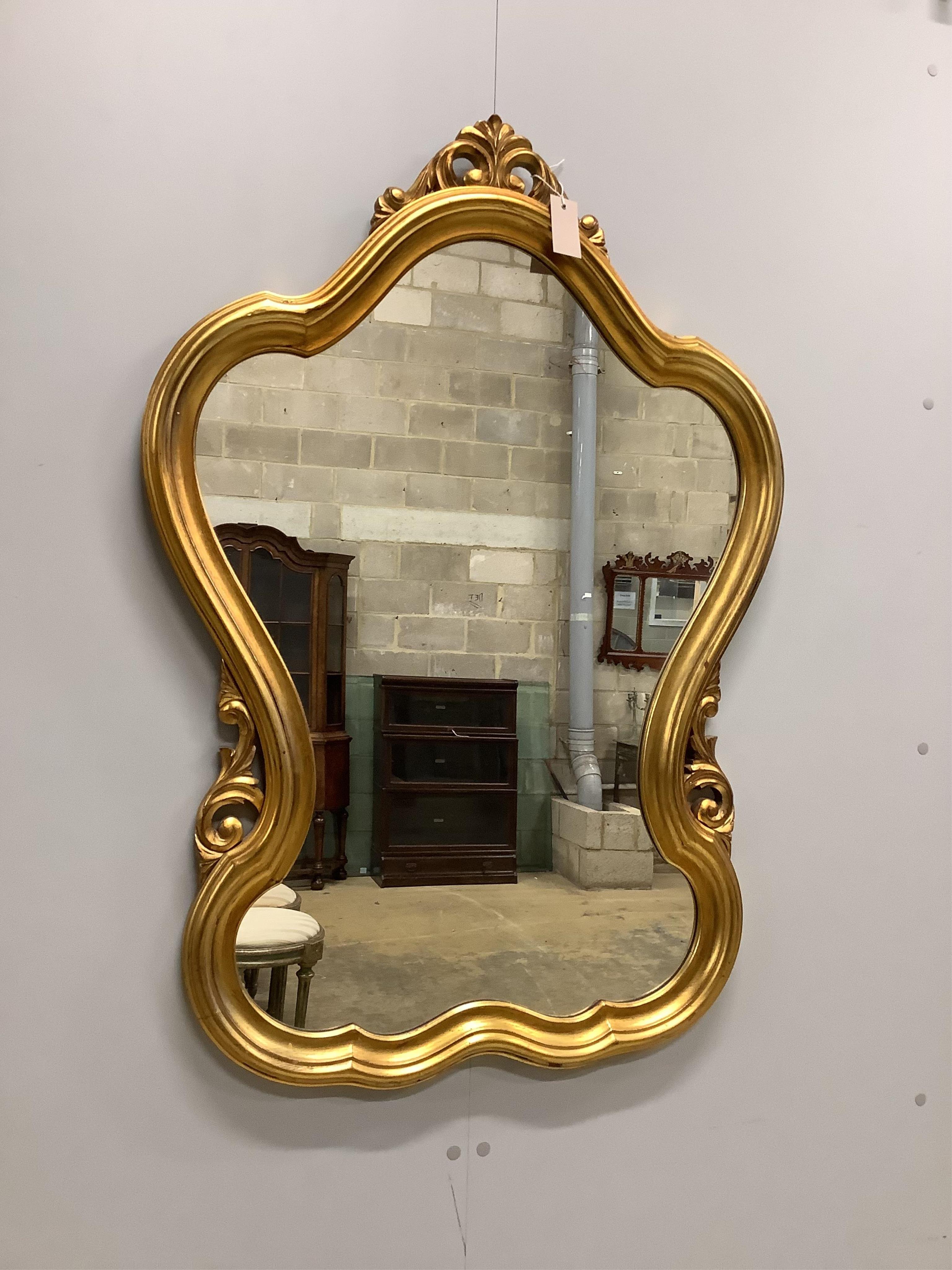 A Victorian style gilt composition wall mirror, width 73cm, height 100cm. Condition - good